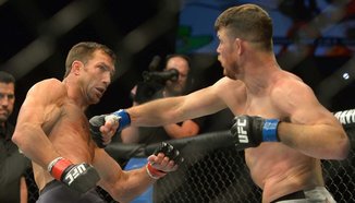 Michael Bisping пита феновете: Да пенсионирам ли Rockhold?